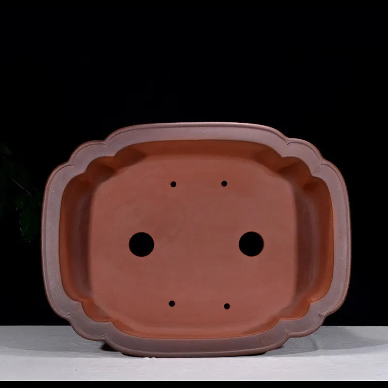 Large antique-finish Chinese purple clay flower pot with detailed tree stump and floral motif sculpture.