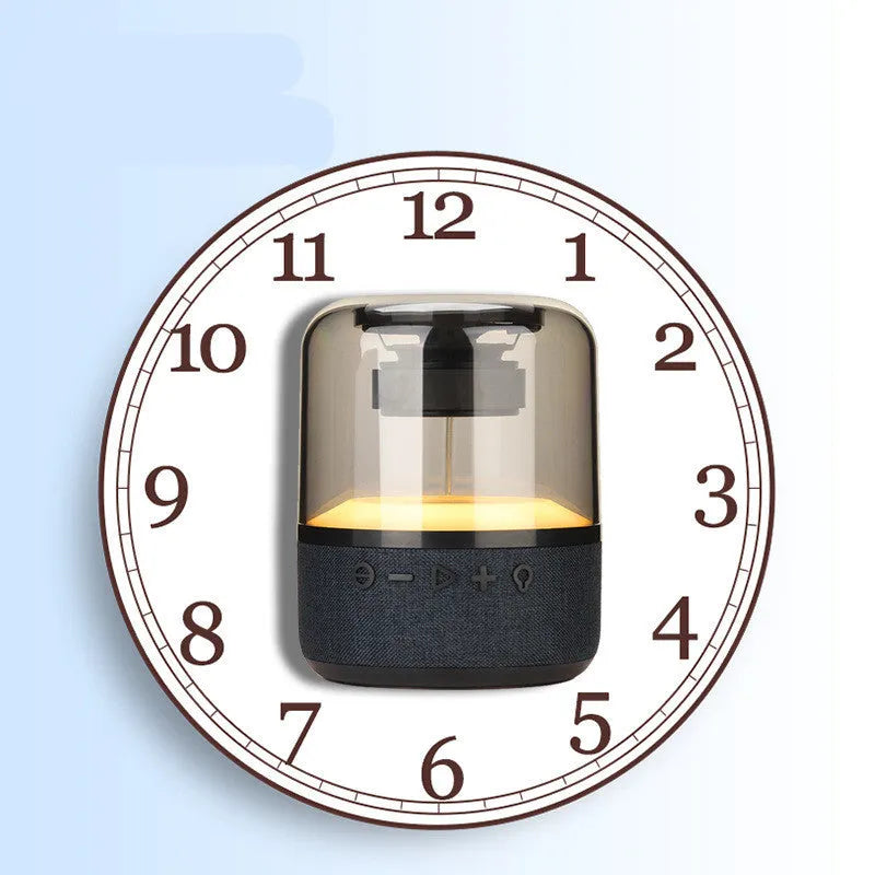 Black wireless Bluetooth speaker with touch controls, showcasing its compact design and 360-degree sound output.