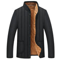 Winter men jacket in dark colour with full zip closure and stand collar, polyester fibre filled regular fit coat