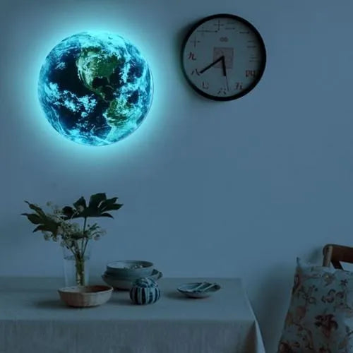 Glow in the dark 3D Earth planet wall sticker in three size options on a wall.