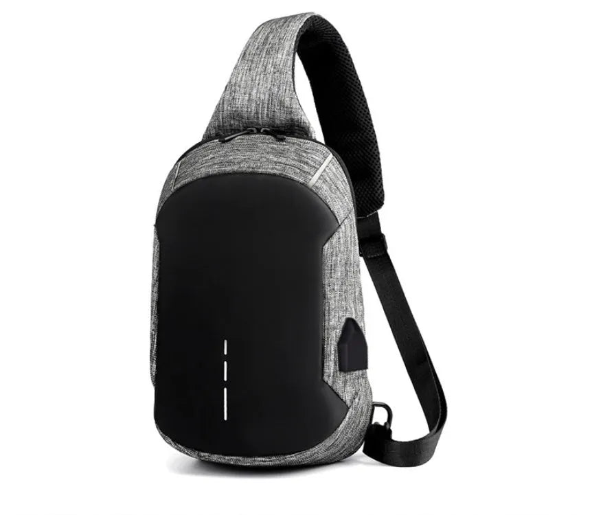 Small square dark blue Oxford cloth chest bag with a single strap and zipper, shown worn across the chest.