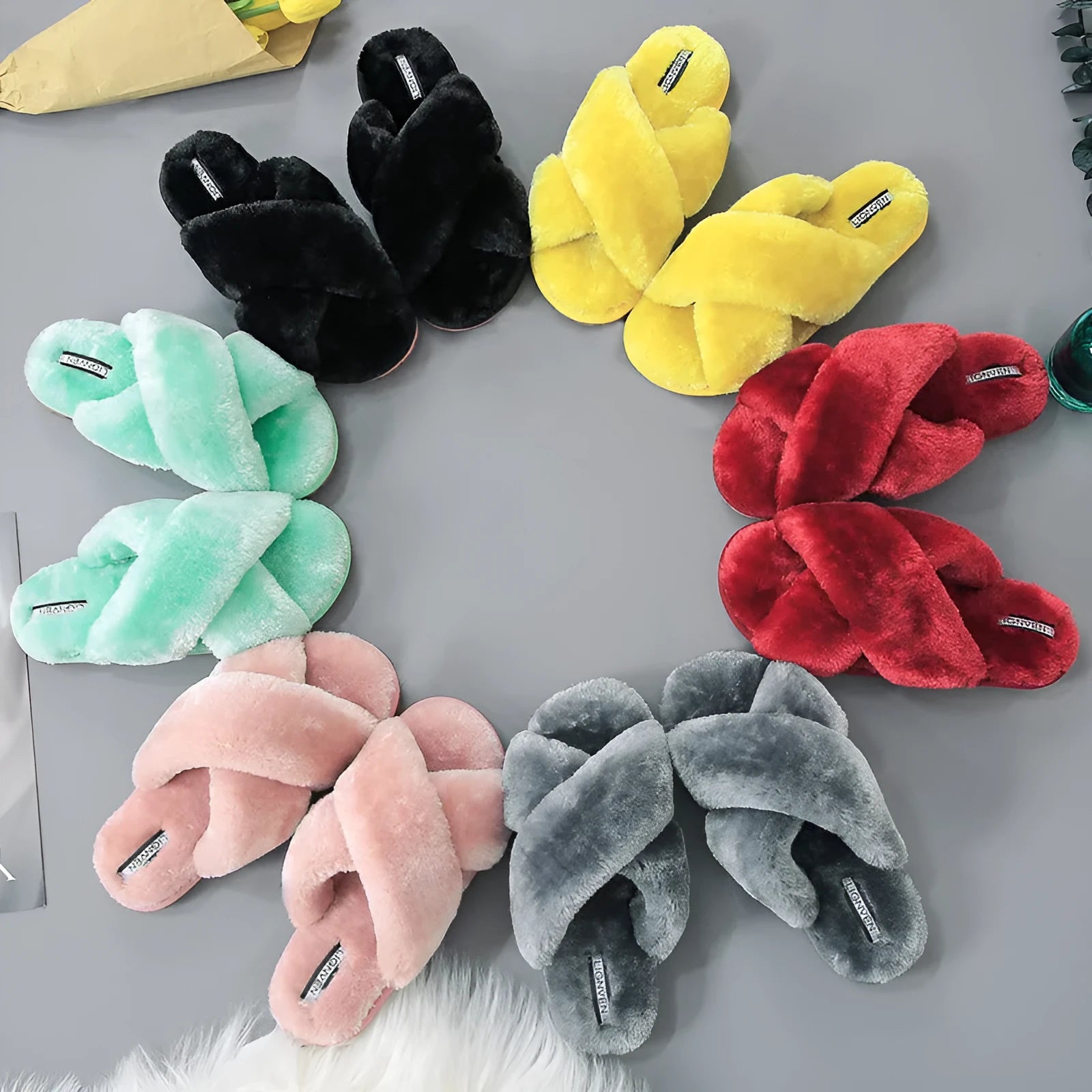 Women's cross open-toe fur slippers in black with patterned rubber sole and anatomical heel design