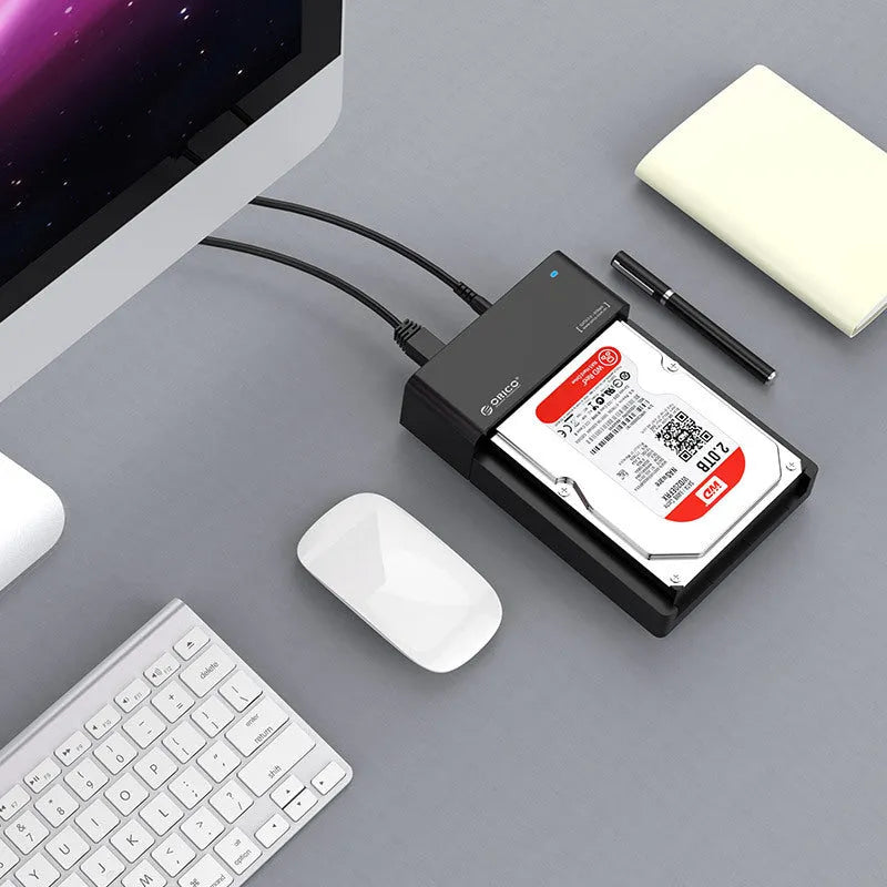 Black plastic hard drive enclosure box for 2.5-inch and 3.5-inch SATA hard drives with USB cable