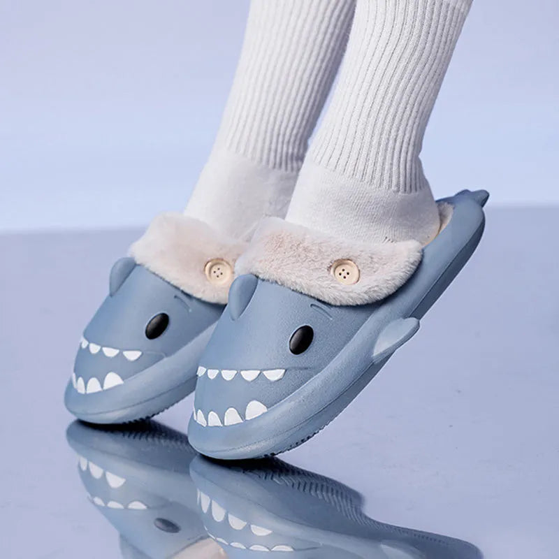 Winter shark button EVA house slippers in haze blue with sewing thread detail on indoor floor