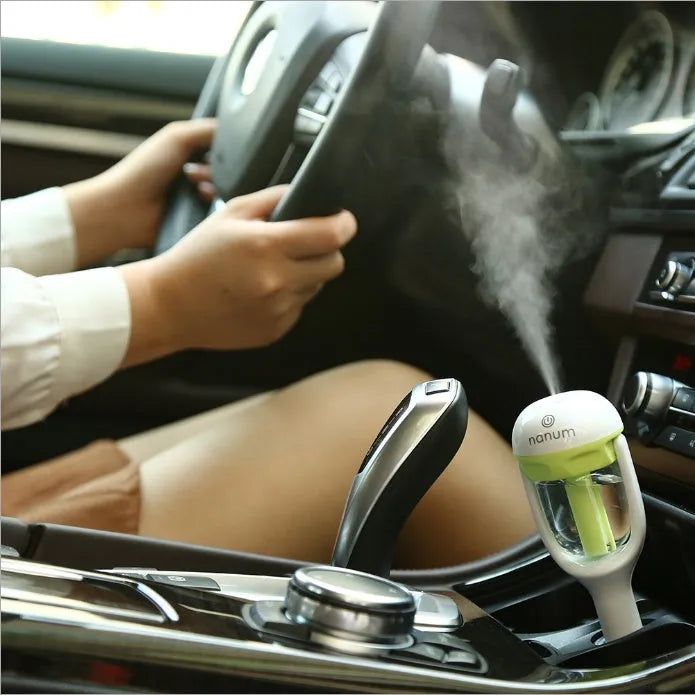 Portable car humidifier and air freshener diffuser with adjustable nozzle for vehicle use