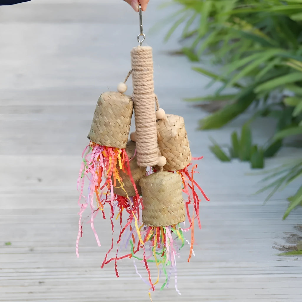 Colourful shredded paper parrot toy with wood and sisal construction measuring 35cm long