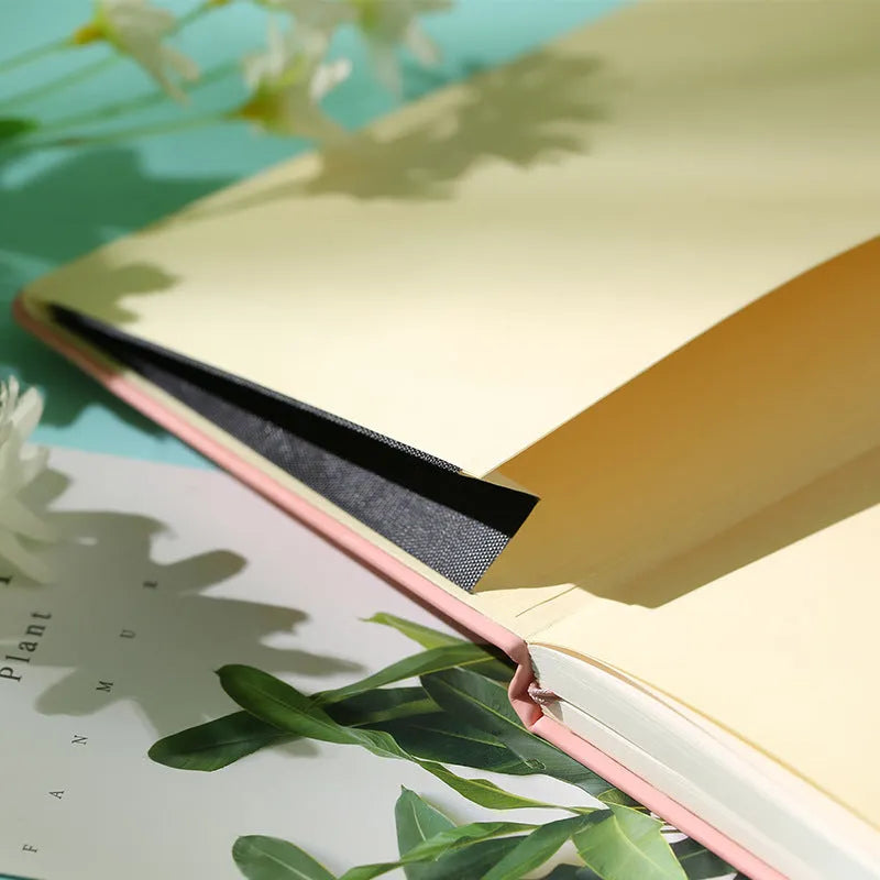 A5 tactile PU hardcover notebook in black with adhesive binding and 100gsm white paper
