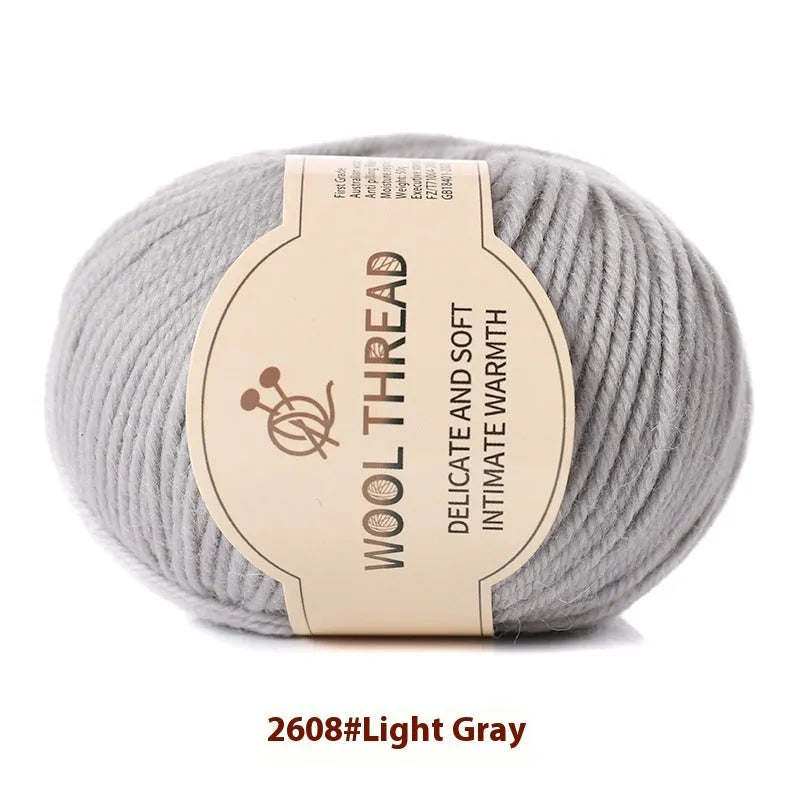 Roll of domestic wool knitting yarn for 10 needles in various colours including green, red, and blue