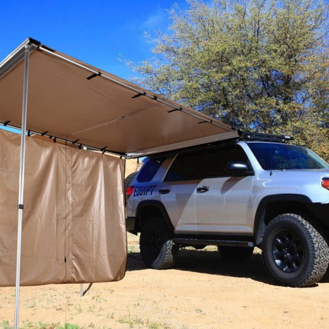 Black rainproof camping tent with aluminium poles set up outdoors, showing two-bedroom interior and Oxford cloth base.