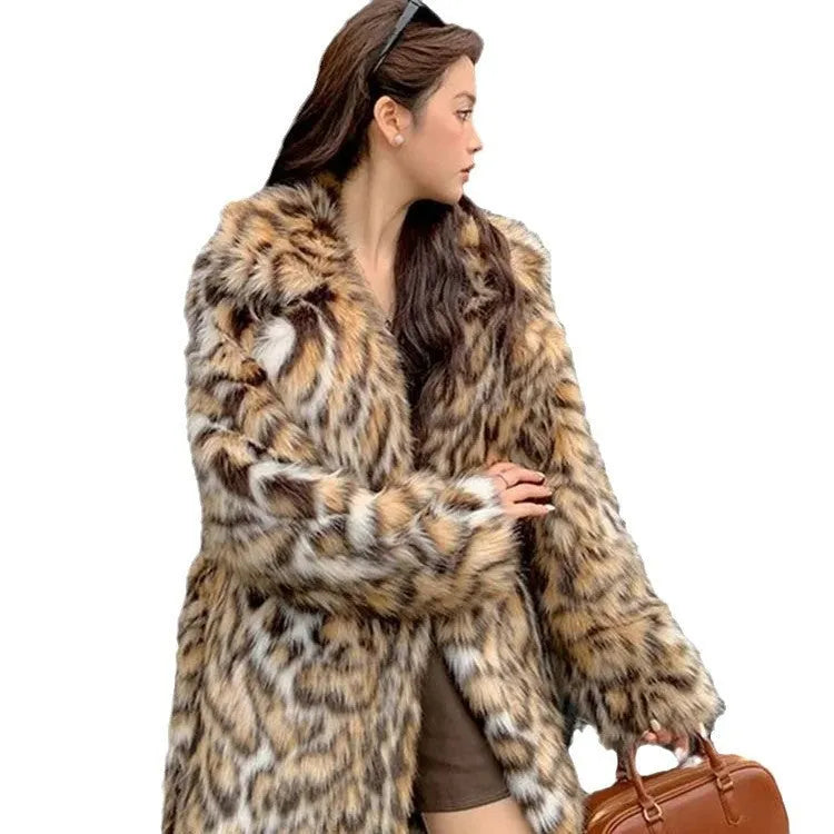 A long faux fur street fashion coat with a fur collar and pockets, shown in an urban setting.