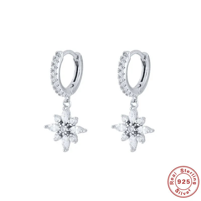 Sterling silver snowflake pendant earrings with diamond accents in white gold or yellow gold colour finish.