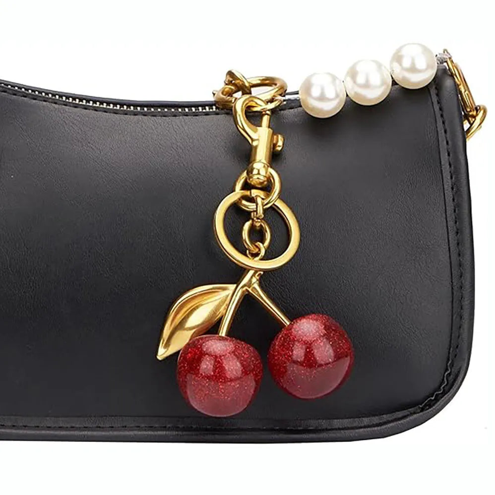 Three-dimensional cherry key ring in zinc alloy available in pink or red colours