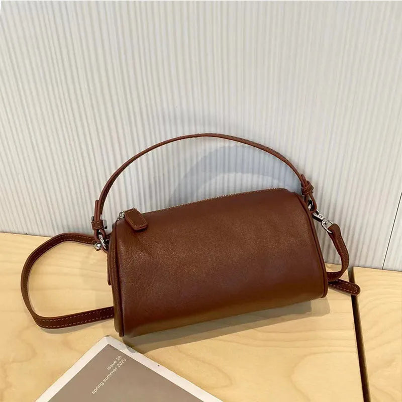 Genuine leather cylindrical crossbody phone bag in vegetable-tanned leather with single shoulder strap