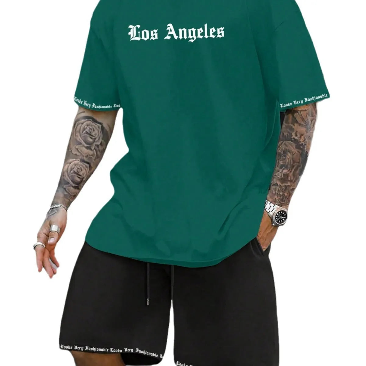 Sports style short-sleeved top and matching shorts set laid flat, showing thin polyester blend fabric.