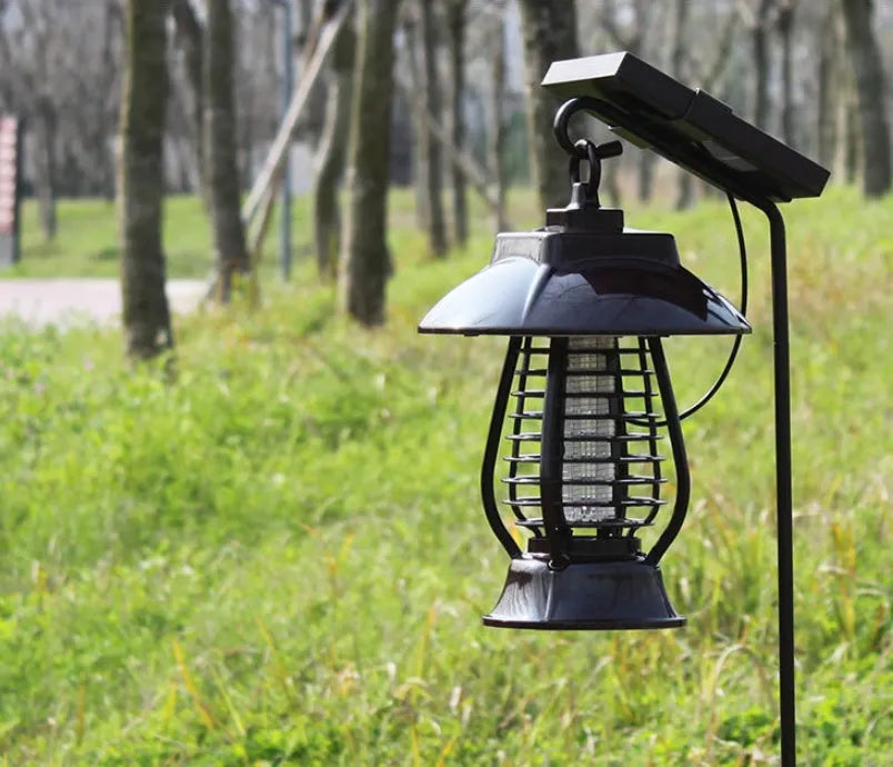 Black solar-powered mosquito lamp with solar panel on top and 24 LED lights for outdoor garden insect control.