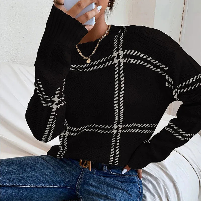 Women's loose fit plaid colour-block acrylic sweater with crew neck in striped apricot, black, beige, red, and green design.