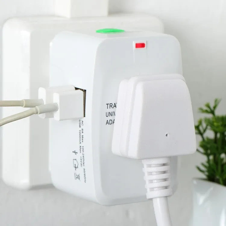 White universal travel plug adapter with two USB ports and flat-top socket showing AU, EU, US, UK plug compatibility
