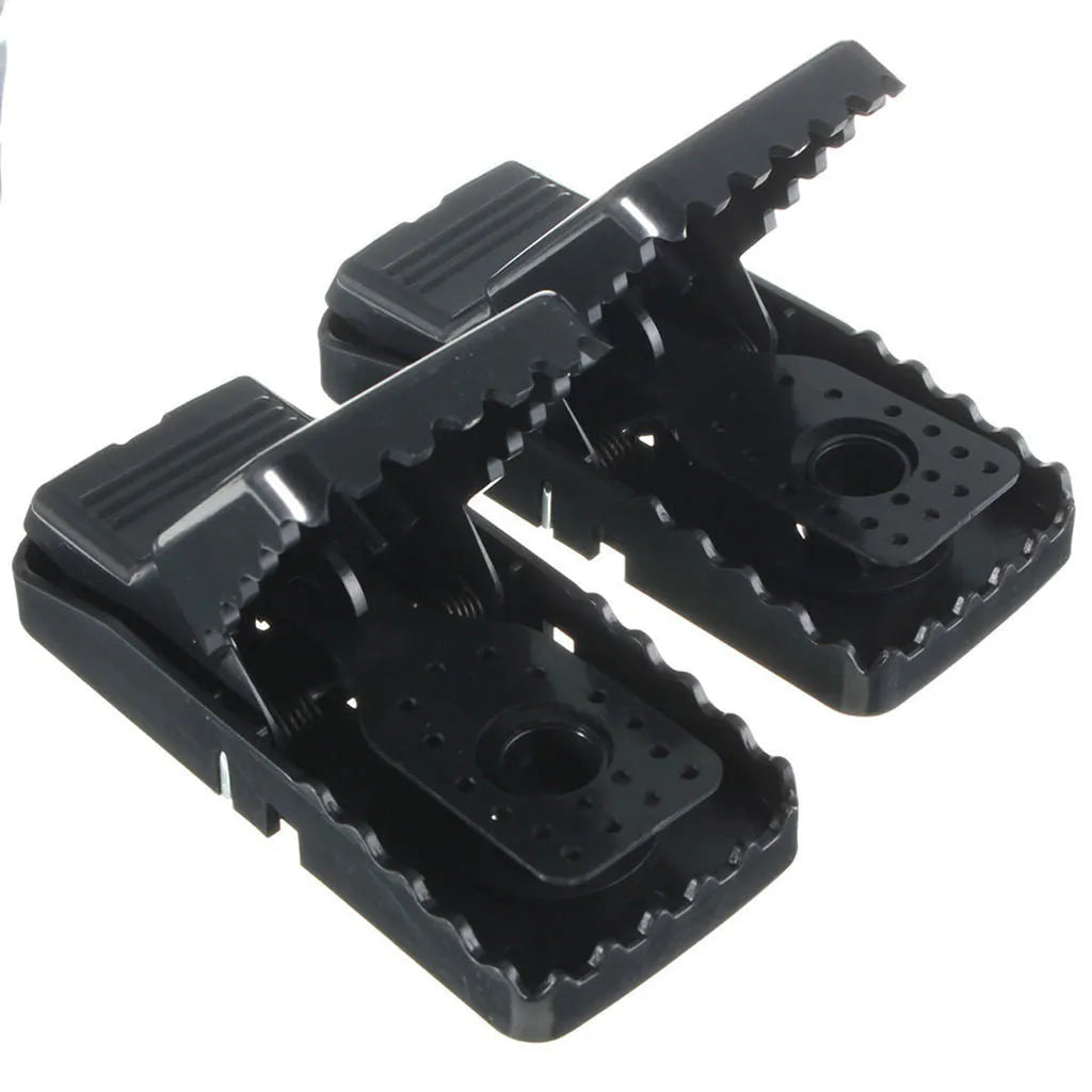Six black plastic snapping mouse traps showing dimensions and smooth surface