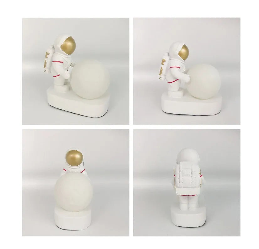 Gold resin astronaut night light on shelf, 14.5cm tall figurine with soft glow