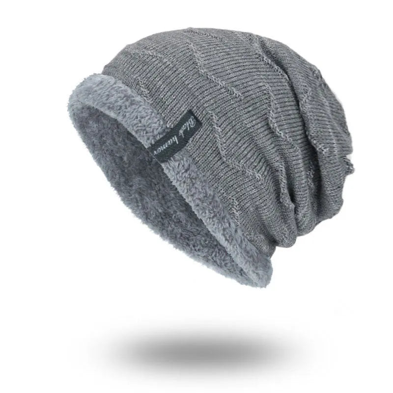 Diagonal hook knitted acrylic beanie in black, showing textured knit pattern