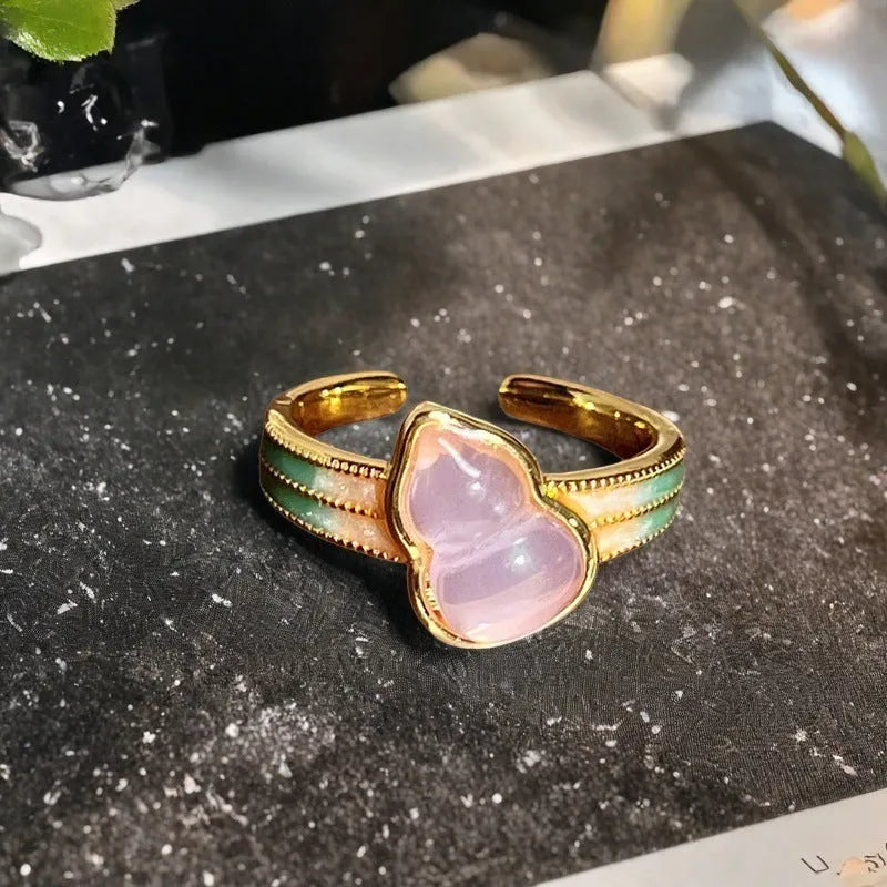 Adjustable copper women's ring with vintage oil drip finish, gourd shape, and inlaid zircon stones in floral and bow designs.