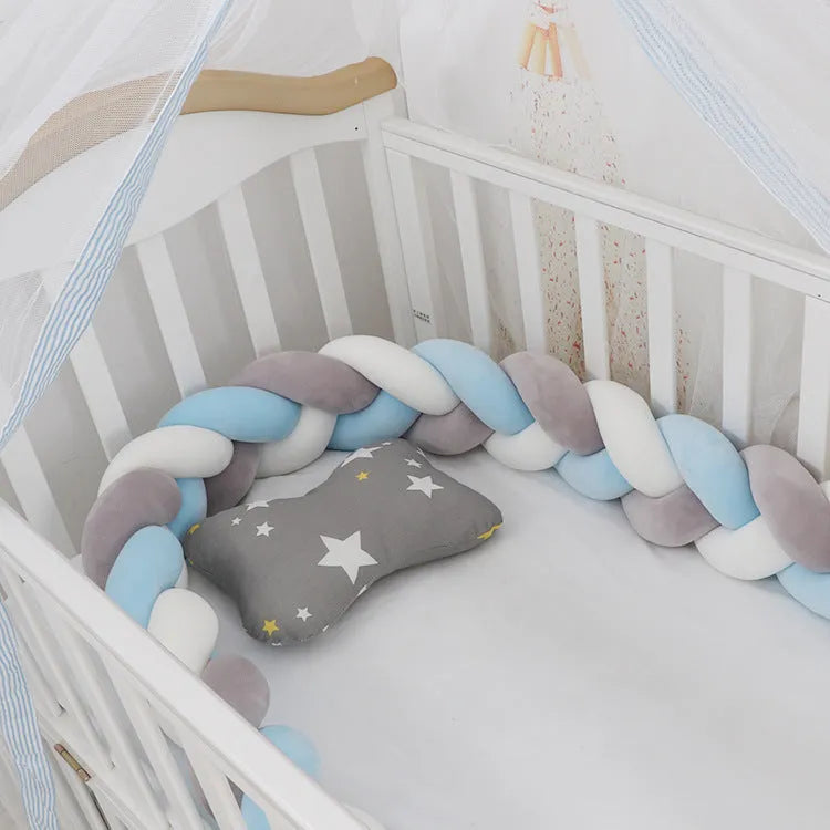 Baby crib bumper braid knot pillow cushion in spandex velvet, shown in a light grey colour