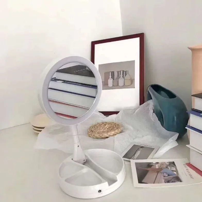 White acrylic vanity mirror with LED lights, double-sided magnification, and foldable design