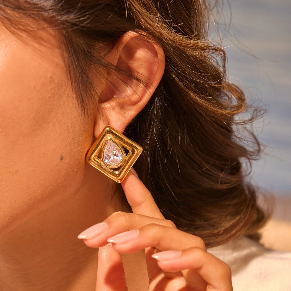 Gold plated geometric stud earrings with water drop zircon inlaid design
