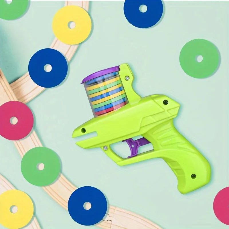 Interactive plastic cat toy launcher with foam disc projectile in green or purple colours