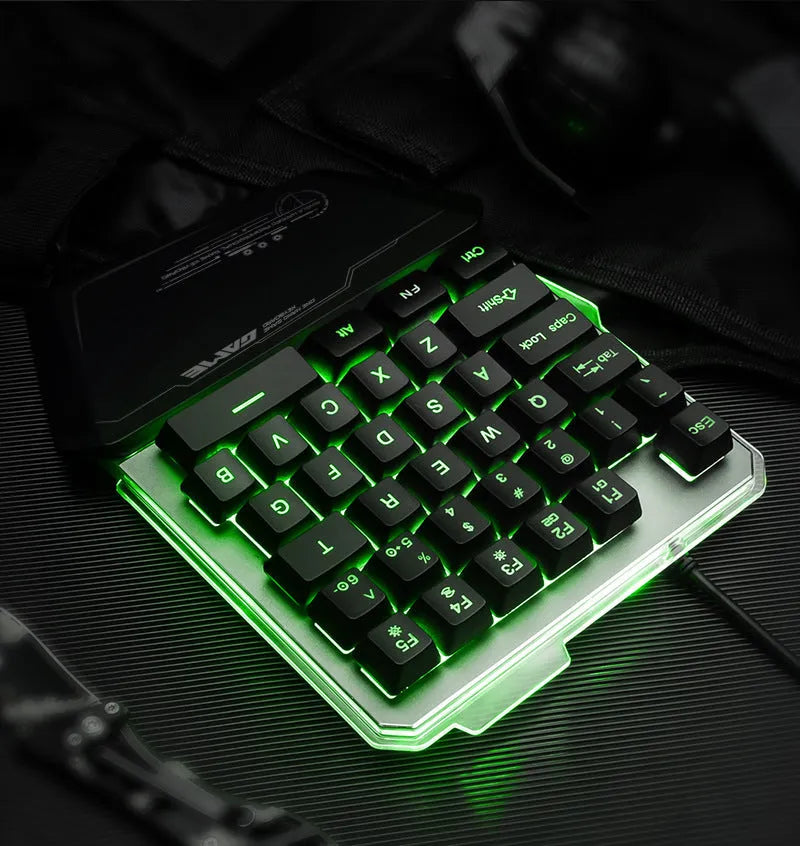 Black robotic one-handed gaming keyboard with RGB backlighting and USB cable