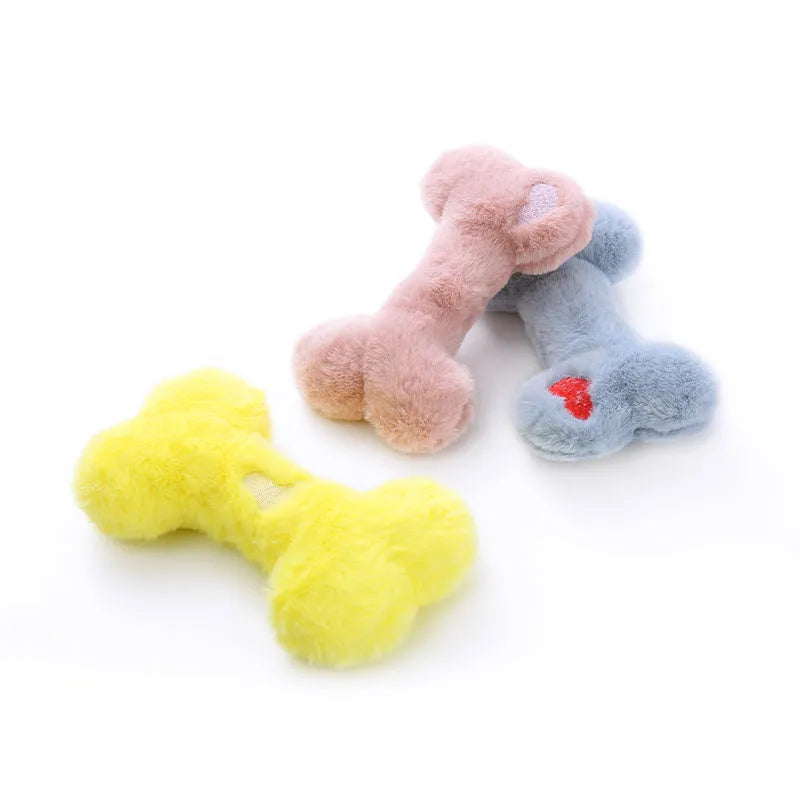 Plush bone-shaped dog toy in blue, pink or yellow with a squeaker for interactive chewing play.