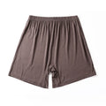 Men's solid colour modal boxers on a white background, showing high-waist design in black, blue, and gray.