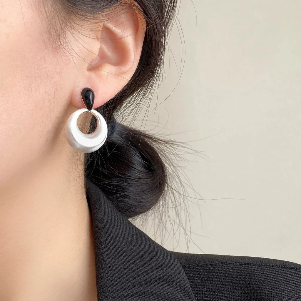 Pair of retro geometric drop earrings with enamel colour clash and oil drop finish on copper base