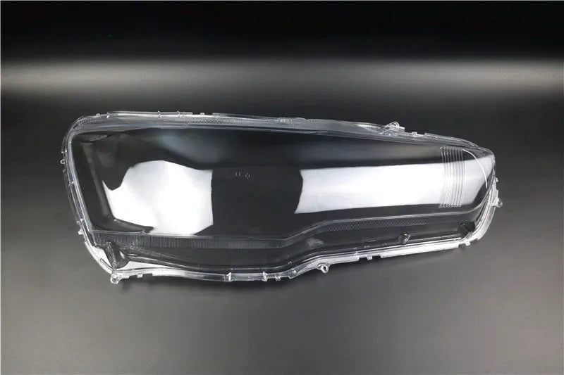 Transparent plastic headlight housing cover for vehicle lighting protection