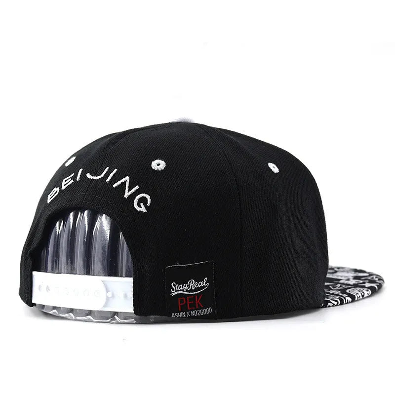 Cotton baseball cap with adjustable strap in black and white colour options