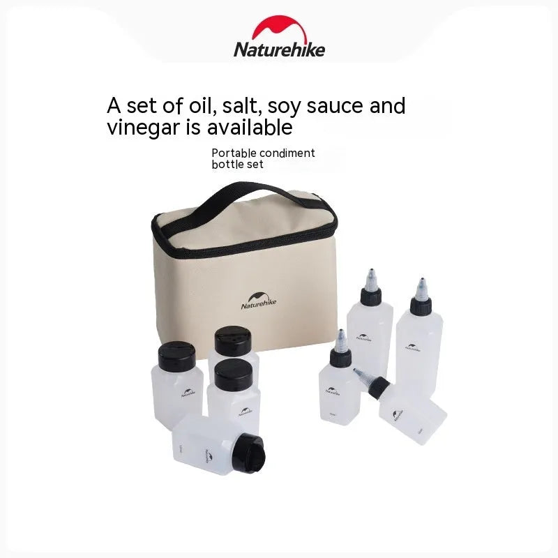 Set of six white portable seasoning bottles with black lids for outdoor picnics and camping.