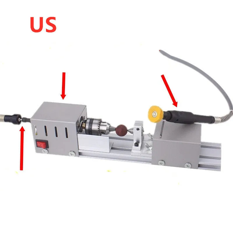 Compact silver metal mini manual woodworking lathe with carving knives on a benchtop