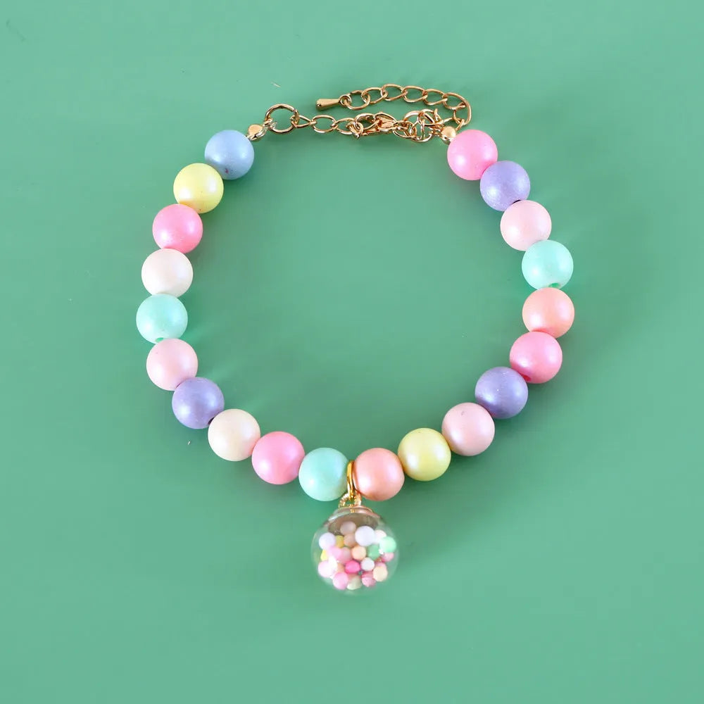 Macaron-themed pet collar accessories in resin with adjustable sizing options