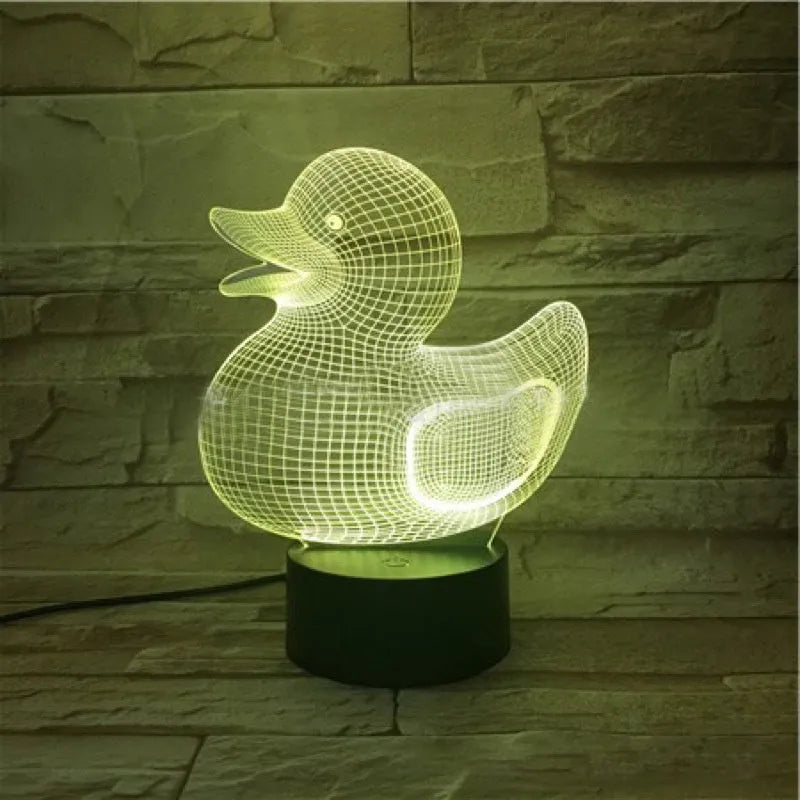 3D cartoon yellow duck LED night light on a table, showing multiple colour options with remote control.