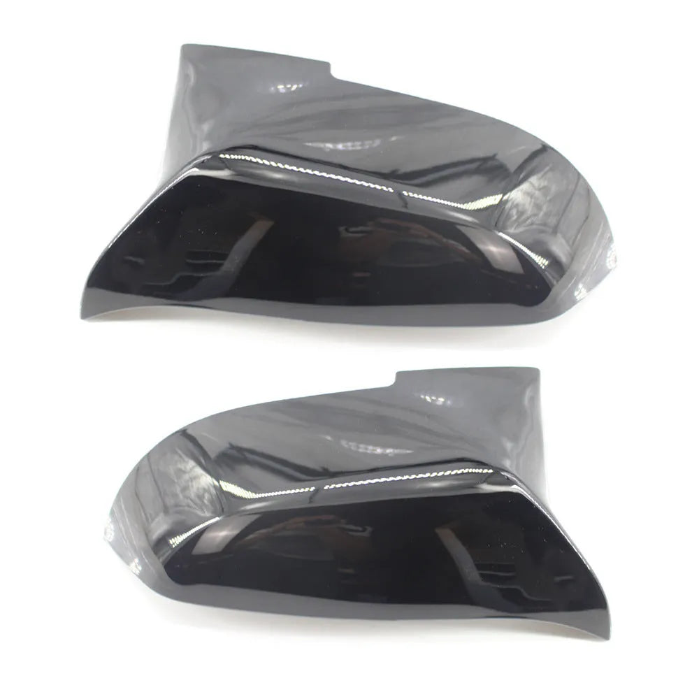 Pair of dark bright black BMW horn-style rear-view mirror replacement shells.