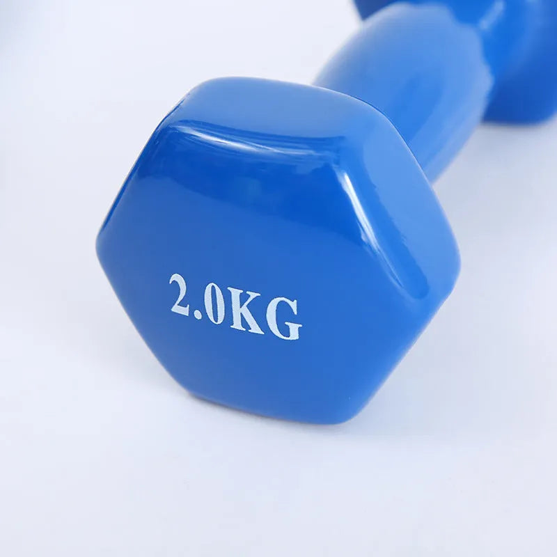 Brightly coloured plastic fitness dumbbells in 0.5kg, 1kg, and 1.5kg weights on a light background