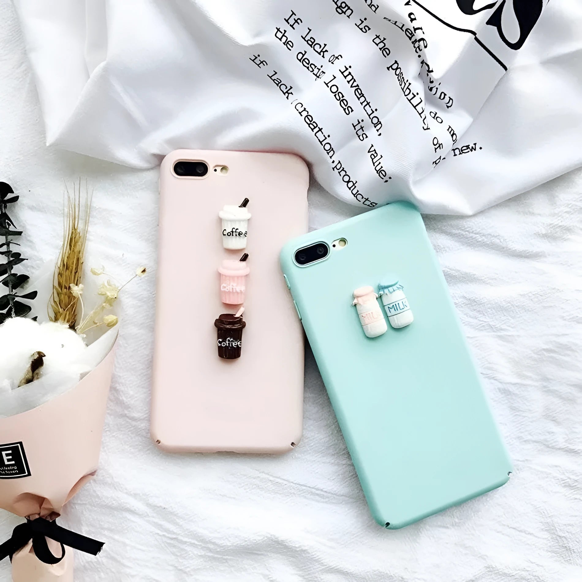 A soft pink silicone iPhone case featuring a raised 3D cartoon cat design on the back.