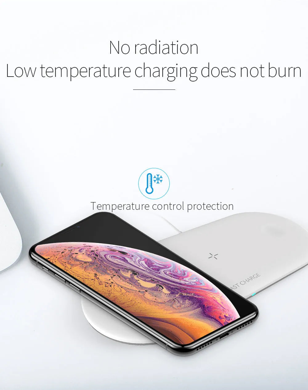 Black and white 3-in-1 wireless charging station for iPhone, Apple Watch and AirPods on a desk.