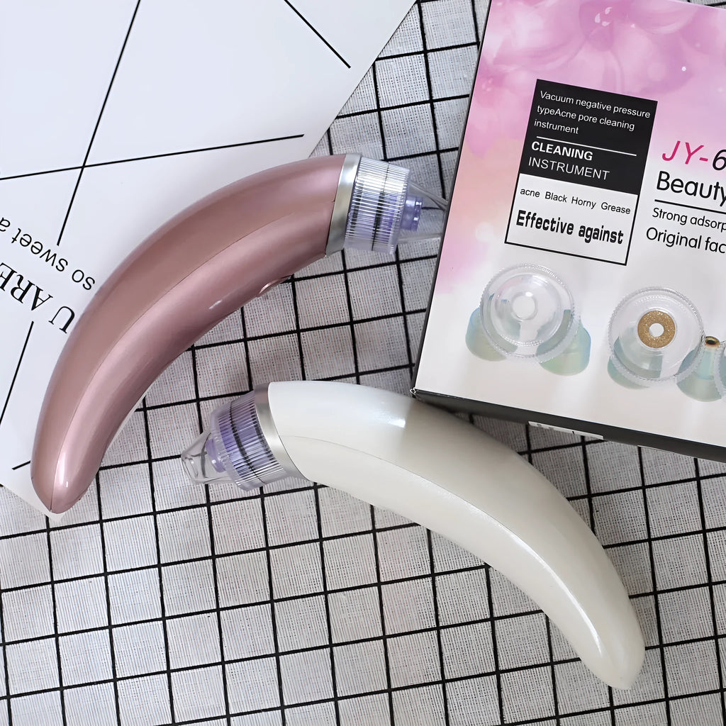 Electric blackhead suction instrument in rose gold or white for facial pore cleansing
