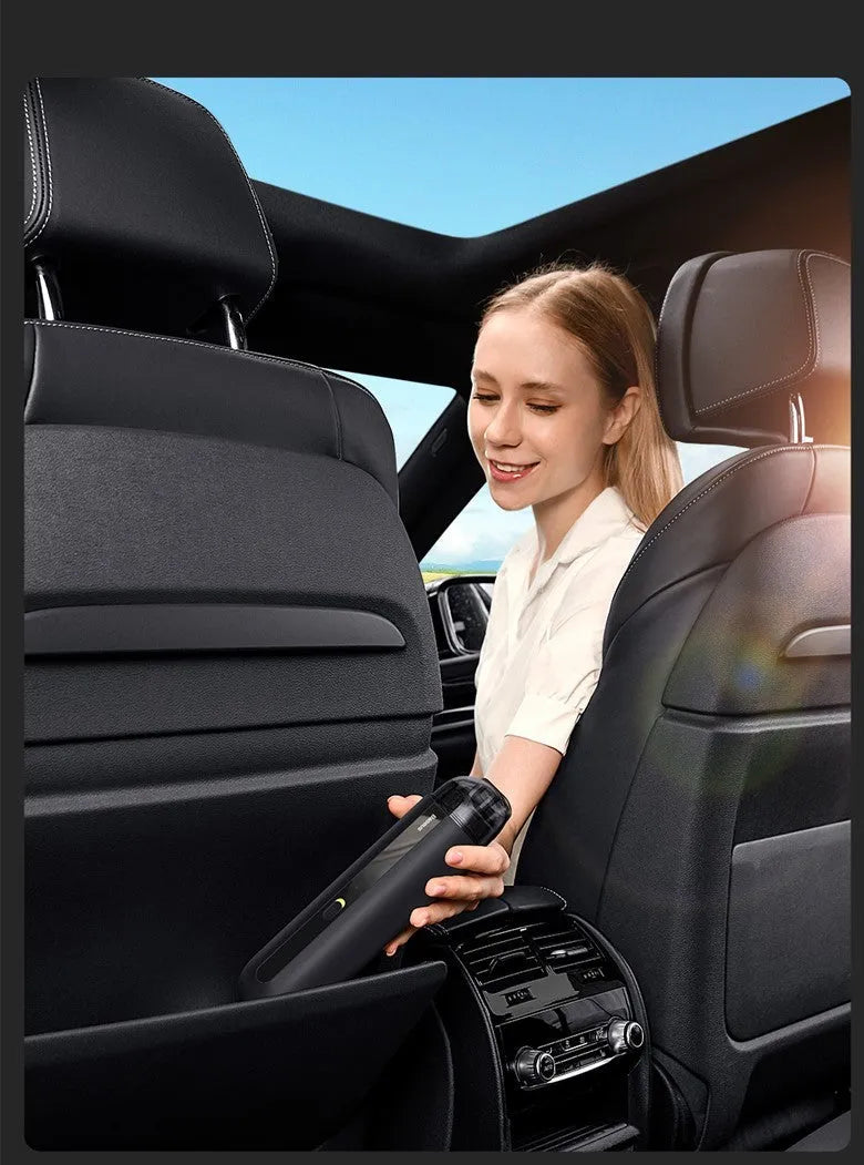 Starry Sky Black wireless handheld car vacuum cleaner with blowing hose on a car seat