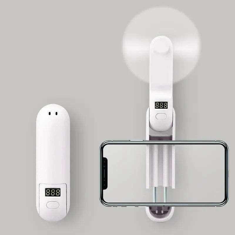 Folding mini personal fan in green colour showing collapsed and open positions with USB charging cable