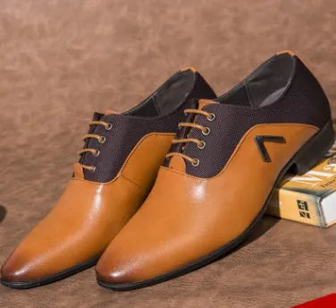 Men's black Oxford shoe with a low upper and rubber sole on a white background.