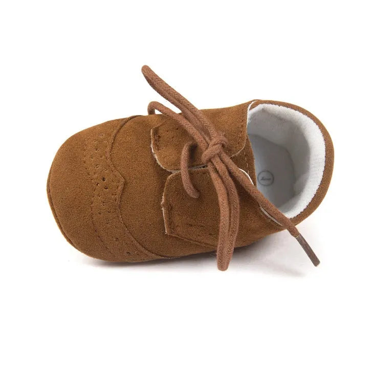 Vintage style baby walking shoes with soft soles and synthetic leather uppers in multiple colours