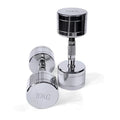 Silver pure steel electroplated dumbbell with ergonomic grip on a grey background.