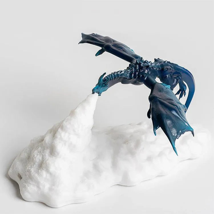 3D printed red dragon night light glowing on a surface with USB charging cable